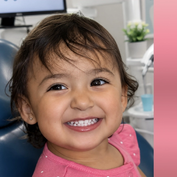 Little Girl In Dental Chair Smiling